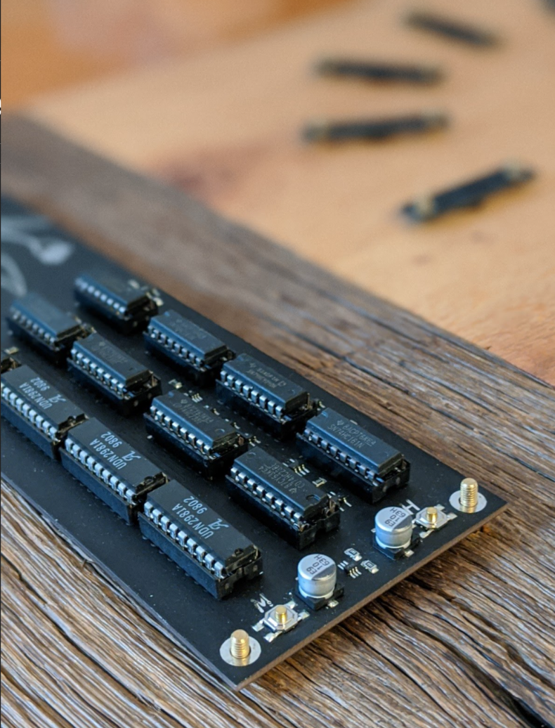 A close up of the CMOS logic ICs mounted on the rough finished oak board. (size: 790x1036px)